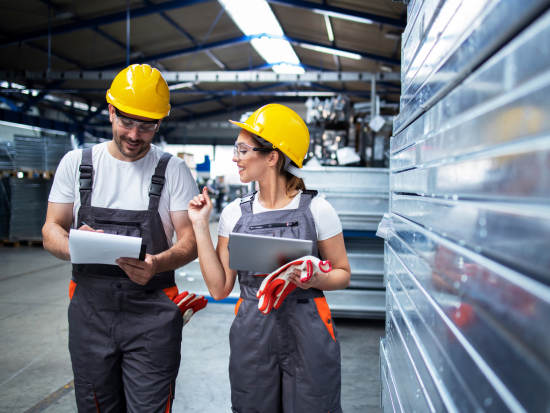 Man and woman in manufacturing plant