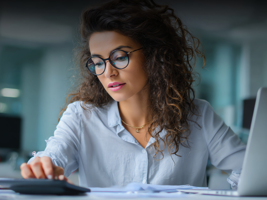 A woman using a calculator
